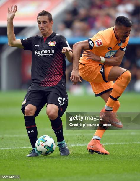 Leverkusen's Dominik Kohr and Hoffenheim's Sandro Wagner in action during the Bundesliga soccer match between Bayer Leverkusen and 1899 Hoffenheim at...