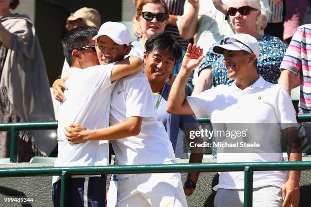 Chun Hsin Tseng of Taiwan celebrates in his players' box after defeating Jack Draper of Great Britain to win the Boys' Singles final on day thirteen...