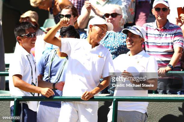 Chun Hsin Tseng of Taiwan celebrates in his players' box after defeating Jack Draper of Great Britain to win the Boys' Singles final on day thirteen...