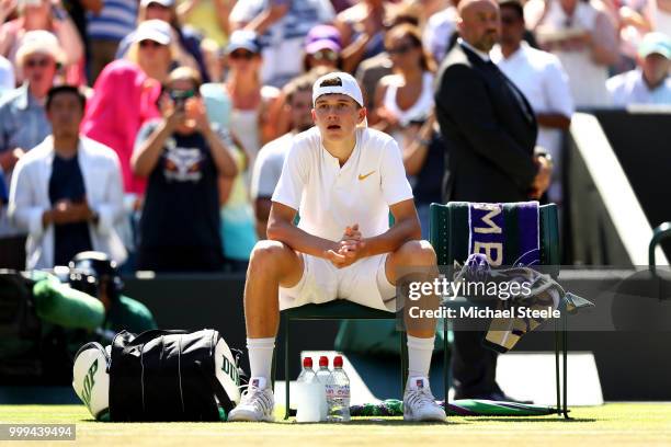 Runner-up Jack Draper of Great Britain reacts after being defeated by Chun Hsin Tseng of Taiwan in the Boys' Singles final on day thirteen of the...