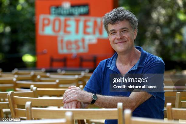 Author Renus Berbig sits in front of a podium in the castle garden at the Erlangen Poets Festival in Erlangen, Germany, 26 August 2017. Photo: Daniel...