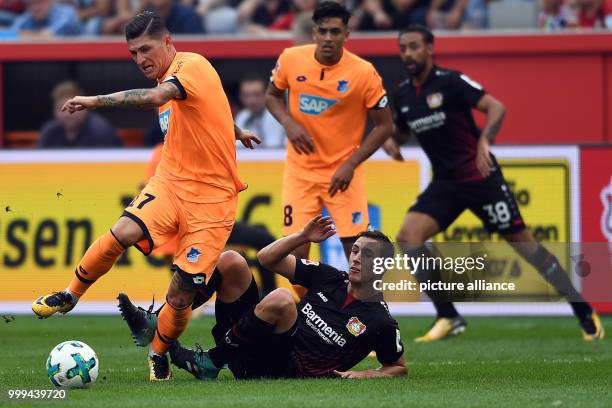 Leverkusen's Dominik Kohr and Hoffenheim's Steven Zuber in action during the Bundesliga soccer match between Bayer Leverkusen and 1899 Hoffenheim at...