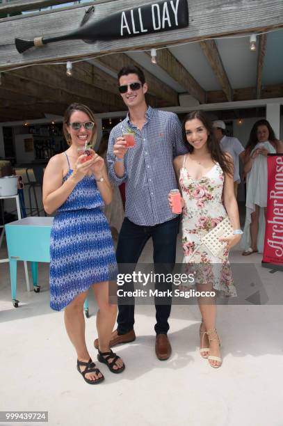 Martha Mosco, John Frangeskos and Julia Macchio attend the Modern Luxury + The Next Wave at Breakers Montauk on July 14, 2018 in Montauk, New York.