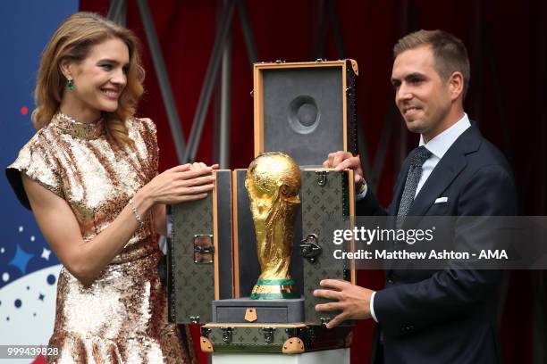 Russian model Natalia Vodianova and Former football player Philippe Lahm with the World Cup trophy during the 2018 FIFA World Cup Russia Final...
