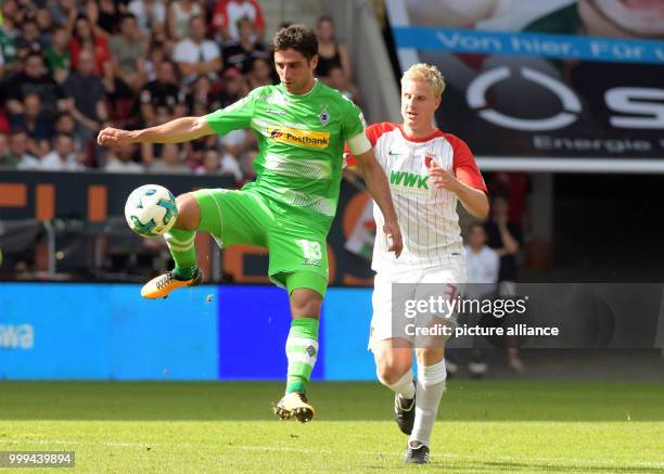 Augsburg's Martin Hinteregger and Gladbach's Lars Stindl in action during the Bundesliga soccer match between FC Augsburg and Borussia...