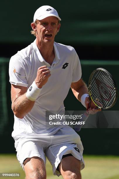 South Africa's Kevin Anderson celebrates a point against Serbia's Novak Djokovic in their men's singles final match on the thirteenth day of the 2018...