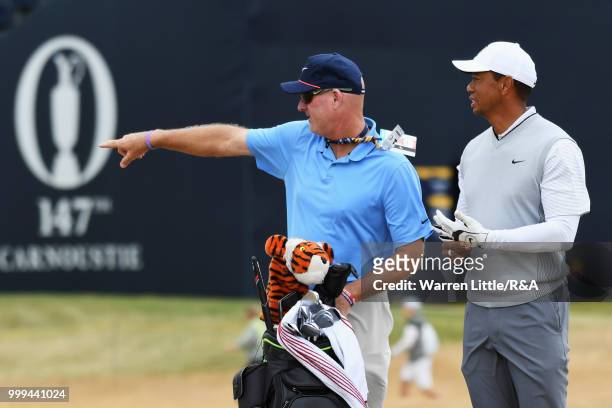 Tiger Woods of the United States and his caddie Joe LaCava seen on the 1st hole while practicing during previews to the 147th Open Championship at...