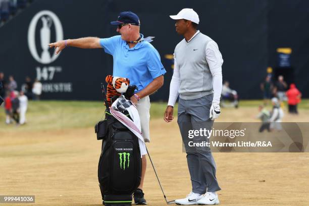 Tiger Woods of the United States and his caddie Joe LaCava seen on the 1st hole while practicing during previews to the 147th Open Championship at...