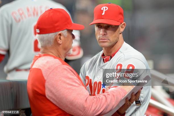 Phillies manager Gabe Kapler talks to pitching coach Rick Kranitz during a game between the Braves and the Phillies on March 30, 2018 at SunTrust...