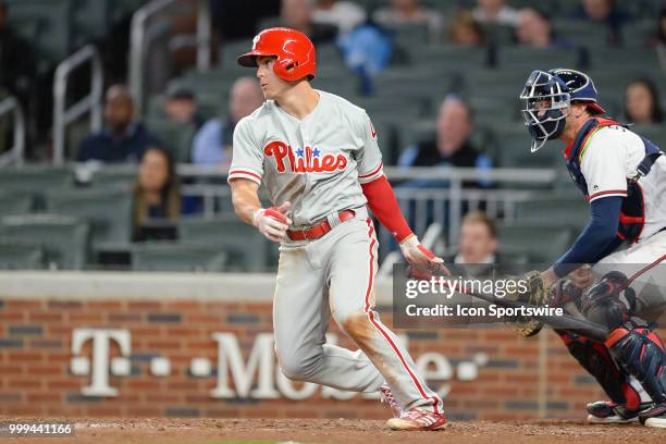 Phillies third baseman Scott Kingery drives a ball to the outfield during a game between the Braves and the Phillies on March 30, 2018 at SunTrust...