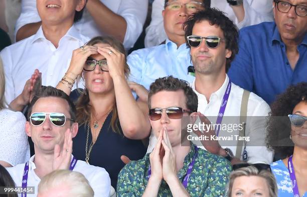 Kate Winslet reacts as Ned Rocknroll looks on during the men's singles final on day thirteen of the Wimbledon Tennis Championships at the All England...
