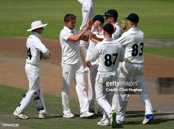 Matthew Milnes of Nottinghamshire celebrates with his team-mates after taking the wicket of Brooke Guest of Lancashire during the Lancashire Second...