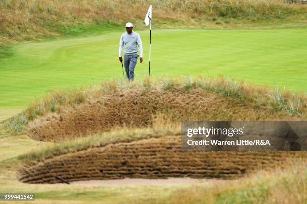 Tiger Woods of the United States putts on the 2nd green while practicing during previews to the 147th Open Championship at Carnoustie Golf Club on...