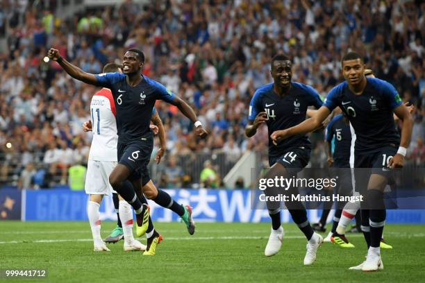 Paul Pogba, Blaise Matuidi and Kylian Mbappe of France celebrate their team's first goal, an own goal scored by Mario Mandzukic of Croatia during the...