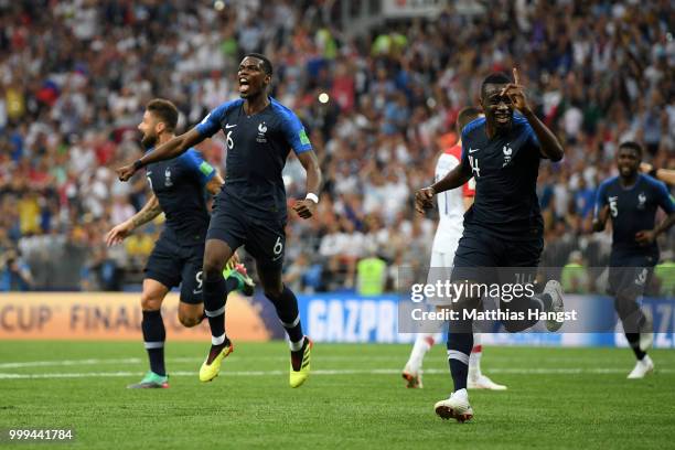 Paul Pogba and Blaise Matuidi of France celebrates after Mario Mandzukic of Croatia scores an own goal for France's first goal during the 2018 FIFA...