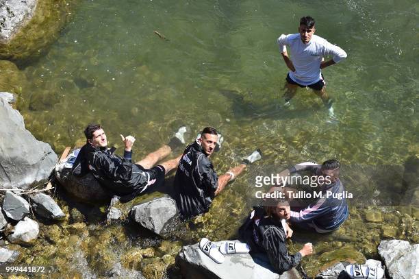Stefano Moreo, Andrea Accardi, Antonino Gallo, Roberto Pirrello and Luca Fiordilino refresh themselves in a river after a training session during the...