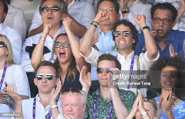 Kate Winslet and Ned Rocknroll react during the men's singles final on day thirteen of the Wimbledon Tennis Championships at the All England Lawn...