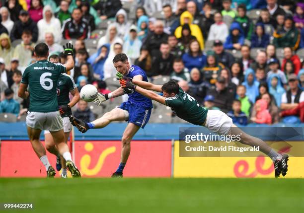 Dublin , Ireland - 15 July 2018; Conor McManus of Monaghan kicks a point ahead of David Hyland of Kildare during the GAA Football All-Ireland Senior...