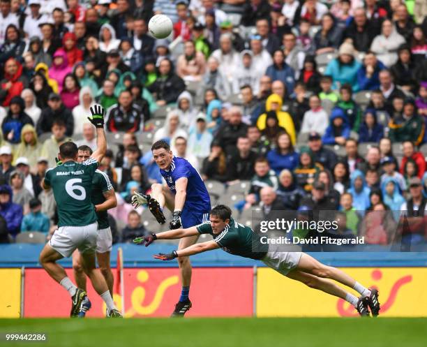 Dublin , Ireland - 15 July 2018; Conor McManus of Monaghan kicks a point ahead of David Hyland of Kildare during the GAA Football All-Ireland Senior...