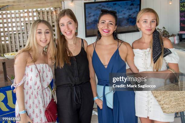 Evan Silvera, Ellie Rakower, Erica Commisso and Polina Meshkova attend the Modern Luxury + The Next Wave at Breakers Montauk on July 14, 2018 in...