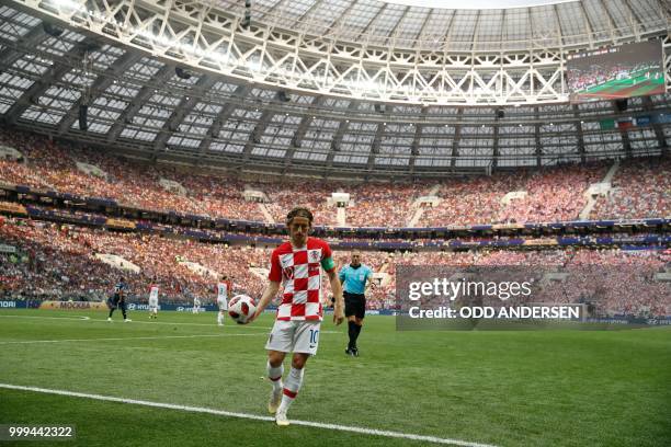 Croatia's midfielder Luka Modric prepares to take a corner during the Russia 2018 World Cup final football match between France and Croatia at the...