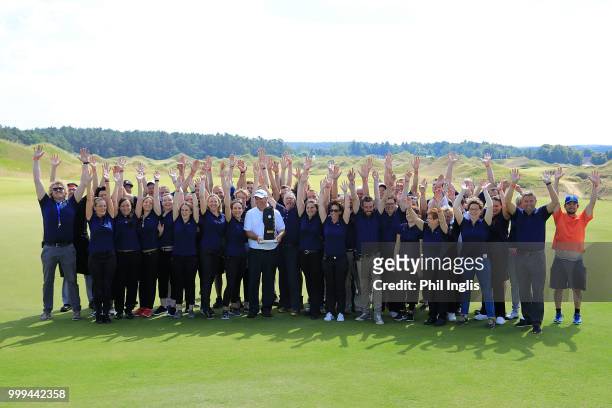 Stephen Dodd of Wales and the volunteers during the prizegiving after the final round on Day Three of the WINSTONgolf Senior Open at WINSTONlinks on...