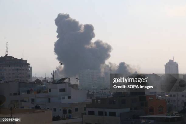 Smoke rises after Israeli fighter jets carried out airstrike to a building in Al Katiba region in Gaza City. Israel's military said it had launched...