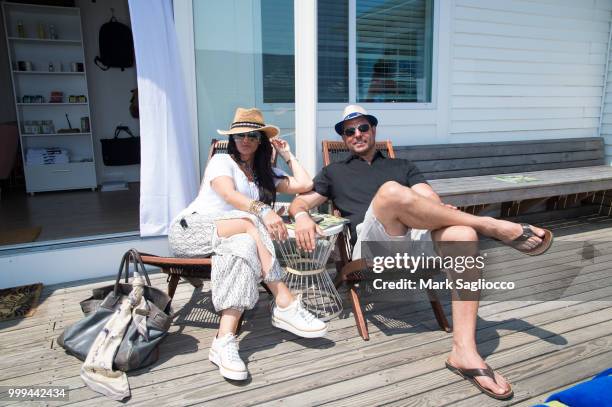 Nicolle Feldman and Dan Feldman attend the Modern Luxury + The Next Wave at Breakers Montauk on July 14, 2018 in Montauk, New York.