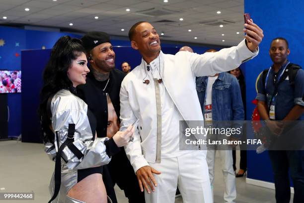 Will Smith, Nicky Jam and Era Istrefi pose for a selfie in the tunnel prior to preforming during the closing ceremony prior to the 2018 FIFA World...