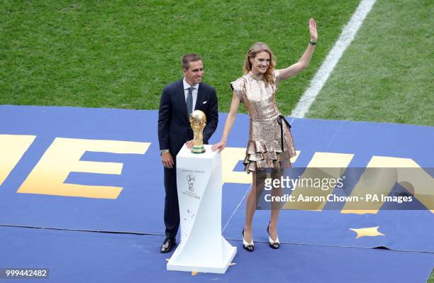 Former Germany captain Philipp Lahm and Natalia Vodianova pose with the world cup trophy prior to the FIFA World Cup Final at the Luzhniki Stadium,...