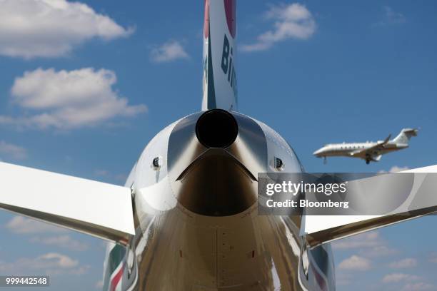 Small executive jet comes into land in view of a Boeing Co. 787 Dreamliner passenger aircraft during preparations ahead of the Farnborough...