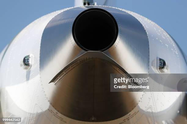 An outlet system sits on the rear of a Boeing Co. 787 Dreamliner passenger aircraft during preparations ahead of the Farnborough International...