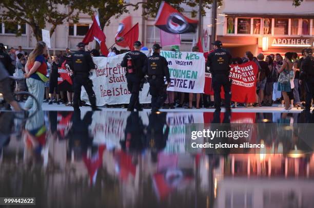 People partake in a demonstration of the leftist scene after the ban of the internet site "linksunten.indymedia.org" on the Augustiner Plaza in...