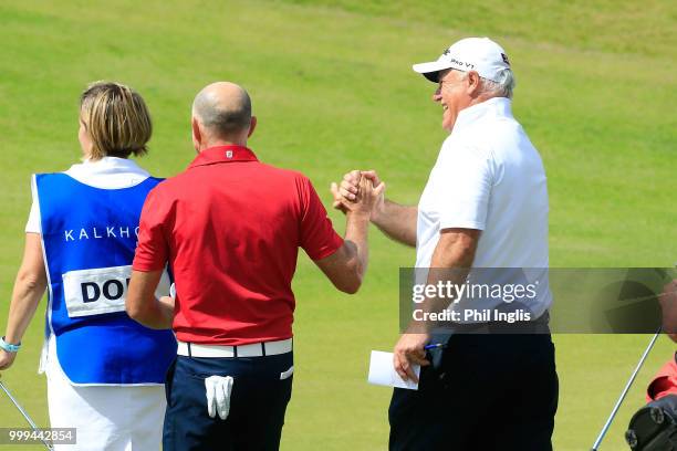 Runner up Jean Francois Remesy of France congratulates Stephen Dodd of Wales on the 18th green during the prizegiving after the final round on Day...