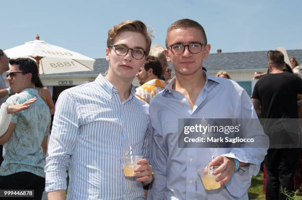 Eugene Cheney and Benjamin Schmidt attend the Modern Luxury + The Next Wave at Breakers Montauk on July 14, 2018 in Montauk, New York.