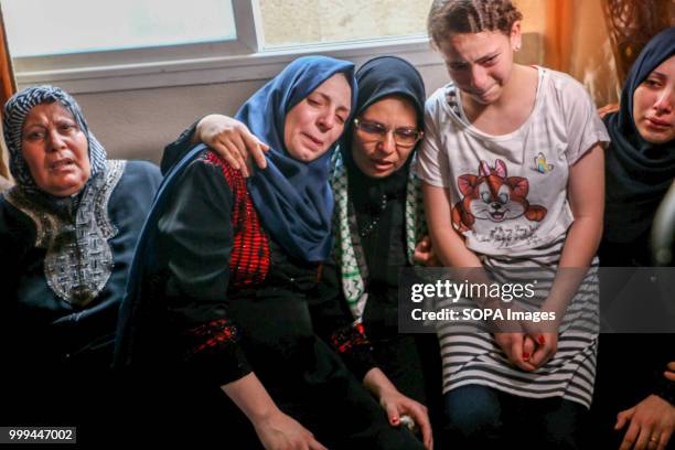 The mother and relatives of the martyr Amir Al-Nimra seen crying during his farewell at his home. Relatives and mourners bid farewell to the bodies...