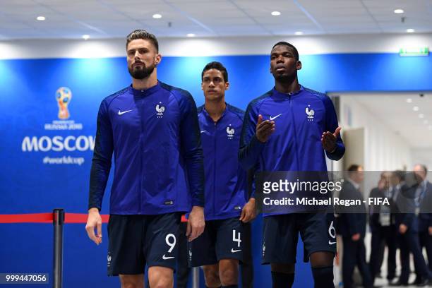 Olivier Giroud, Raphael Varane and Paul Pogba of France look on in the tunnel prior to the 2018 FIFA World Cup Final between France and Croatia at...
