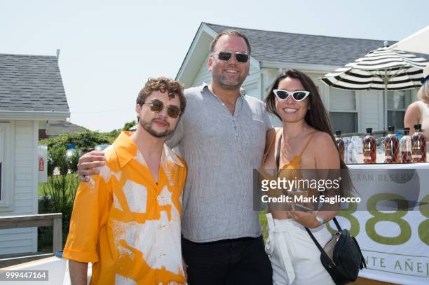 Ian Crumm, Brandon Sansone and Danielle Piro attend the Modern Luxury + The Next Wave at Breakers Montauk on July 14, 2018 in Montauk, New York.