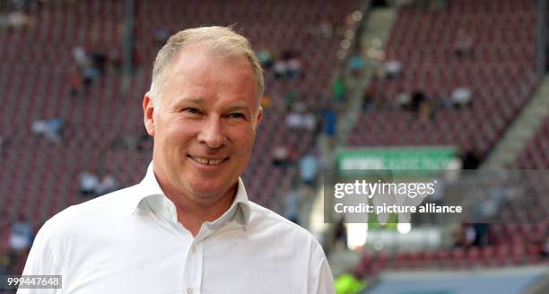 Augsburg head of sports Stefan Reuter laughing ahead of the Bundesliga match pitting FC Augsburg vs Borussia Monchengladbach in the WWK Arena in...