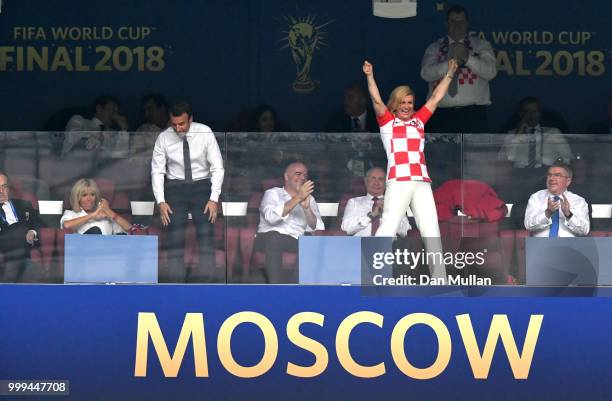 Croatia's President Kolinda Grabar-Kitarovic celebrates his team's first goal during the 2018 FIFA World Cup Final between France and Croatia at...