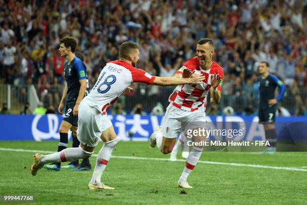 Ivan Perisic of Croatia celebrates with teammate Ante Rebic after scoring his team's first goal during the 2018 FIFA World Cup Final between France...