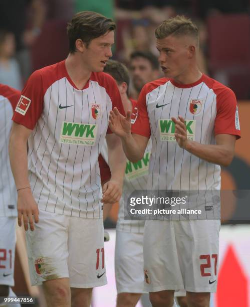 Augsburg's forwards Michael Gregoritsch and Alfred Finnbogason talking after the Bundesliga match pitting FC Augsburg vs Borussia Monchengladbach in...
