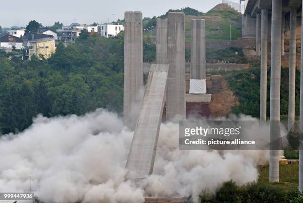 Dpatop - The second bridge pillar of the old A3 Lahntalbridge is being blasted in the course of the demolition works in Limburg, Germany, 27 August...