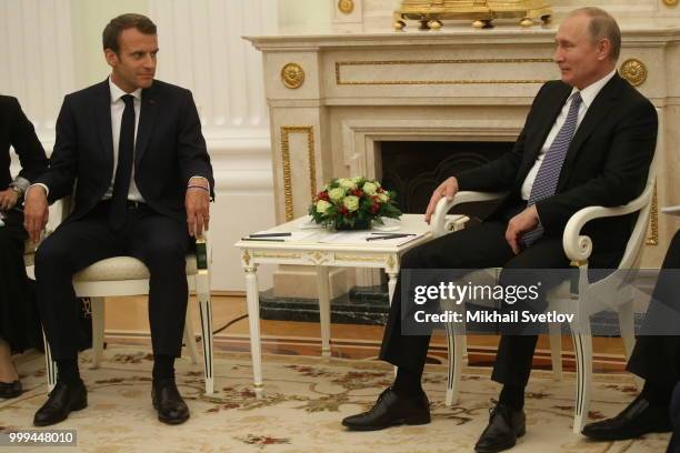 Russian President Vladimir Putin greets French President Emmanuel Macron during their talks at the Kremlin, in Moscow, Russia, July 15, 2018. Macron...