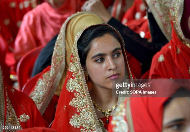 Kashmiri Muslim bride attend a mass-wedding ceremony in Sonwar area of Srinagar, the summer capital of Indian controlled Kashmir, India. At least 105...