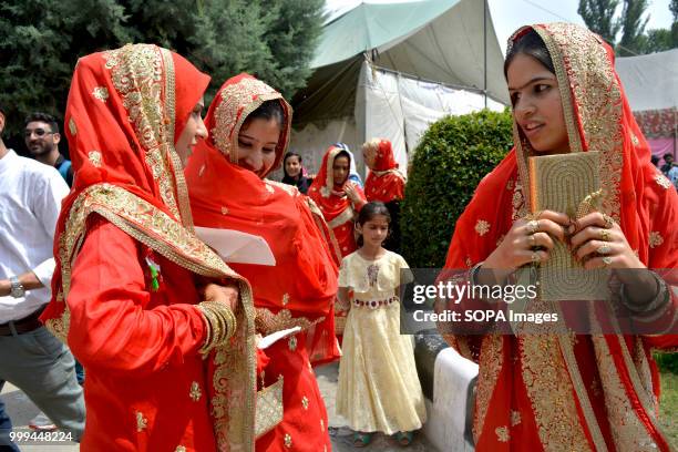 Kashmiri Muslim brides attend a mass-wedding ceremony in Sonwar area of Srinagar, the summer capital of Indian controlled Kashmir, India. At least...