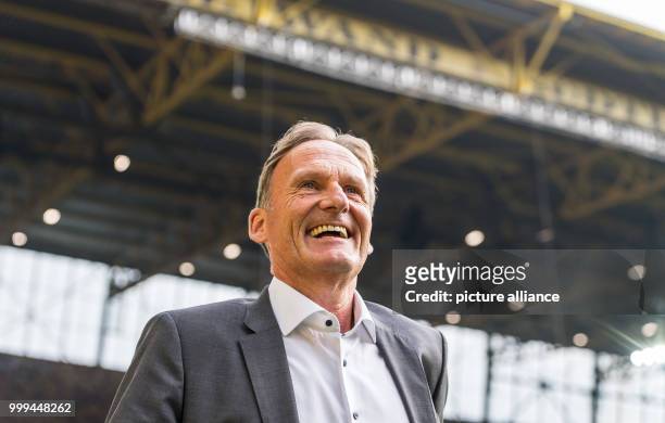 Dortmund's managing director, Hans-Joachim Watzke, walking along the sidelines laughing ahead of the Bundesliga match pitting Borussia Dortmund vs...
