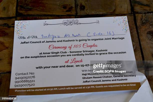 Invitation wedding card for bride and groom to attend a mass-wedding ceremony in Sonwar area of Srinagar, the summer capital of Indian controlled...