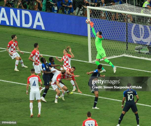 Mario Mandzukic of Croatia falls after deflecting the ball past Croatia goalkeeper Dominik Livakovic to score the first goal of the match during the...