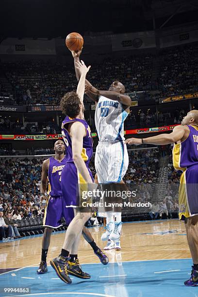 Emeka Okafor of the New Orleans Hornets takes a jumpshot against Pau Gasol of the Los Angeles Lakers on March 29, 2010 at the New Orleans Arena in...